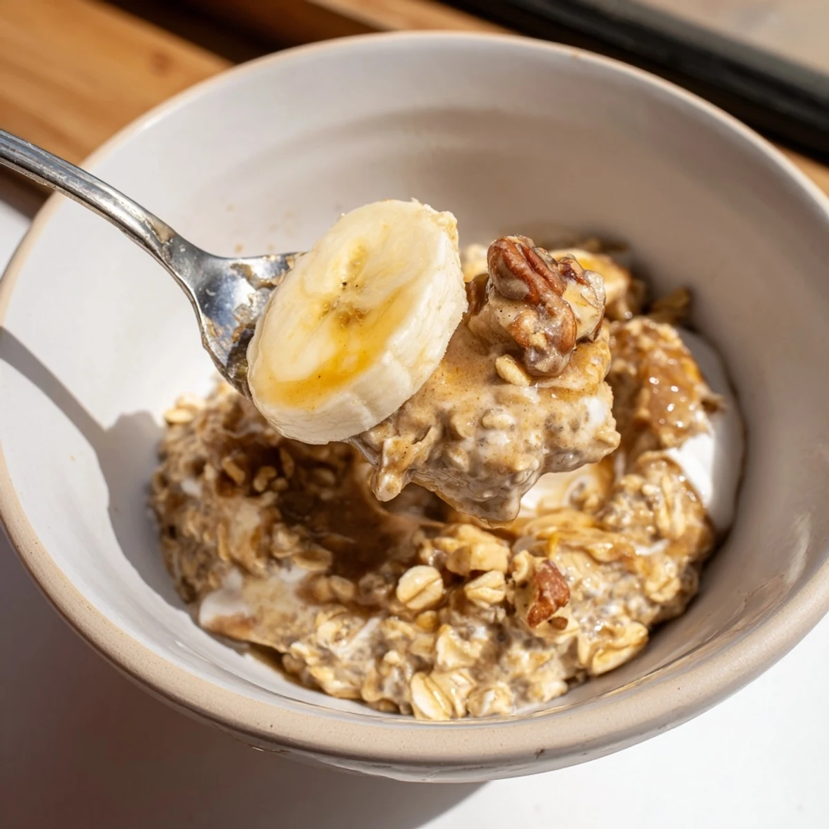 Creamy Brown Sugar Coffee Overnight Oats in a jar topped with sliced banana