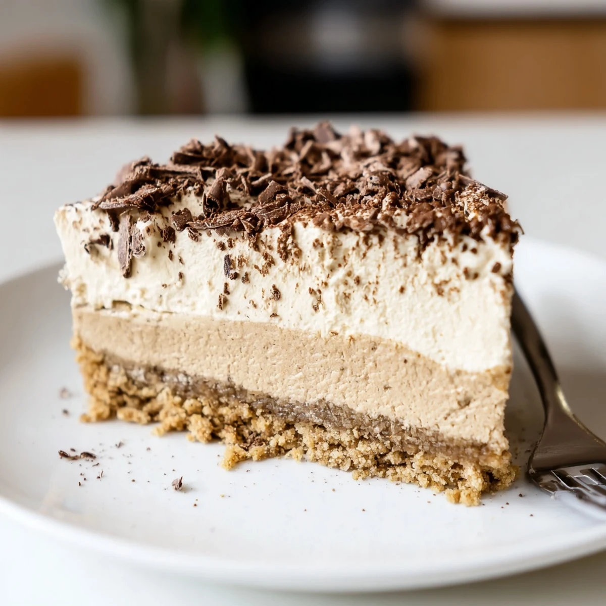 Decadent Creamy Coffee Infused Tiramisu Cheesecake cooling with cocoa dusting, whipped cream
