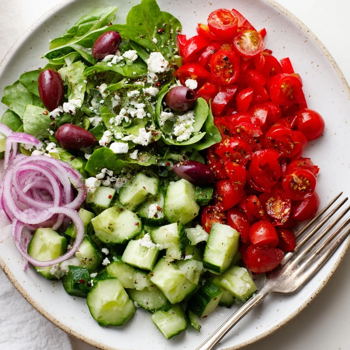 Bright tossed salad with olive oil, feta, and peppery arugula, Fresh Salad Recipe.