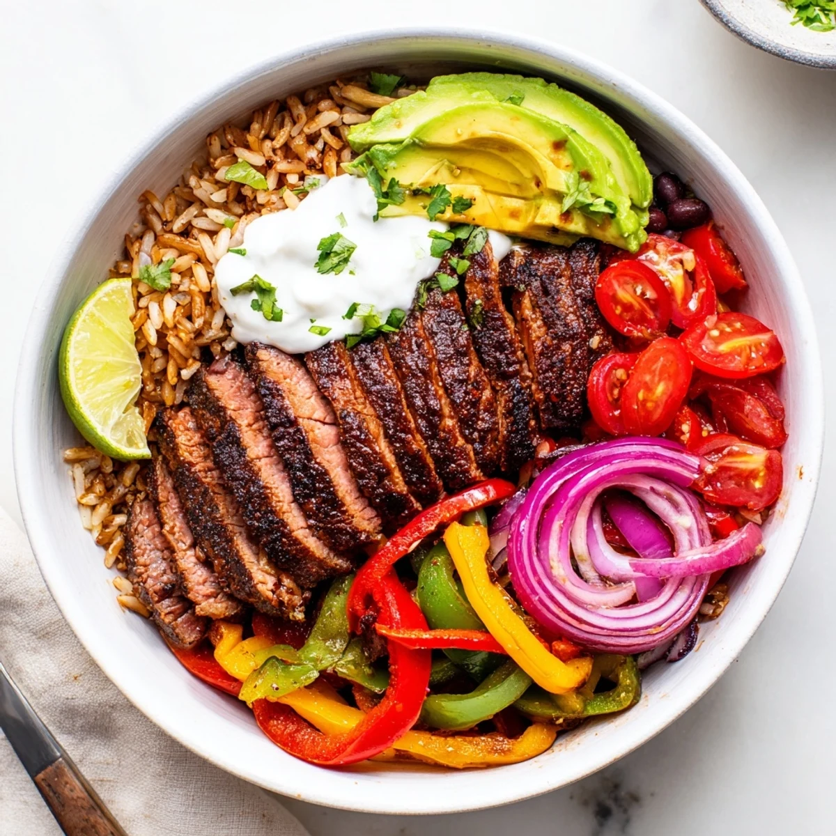 Steak Fajita Power Bowls with sizzling marinated steak and colorful sauteed peppers