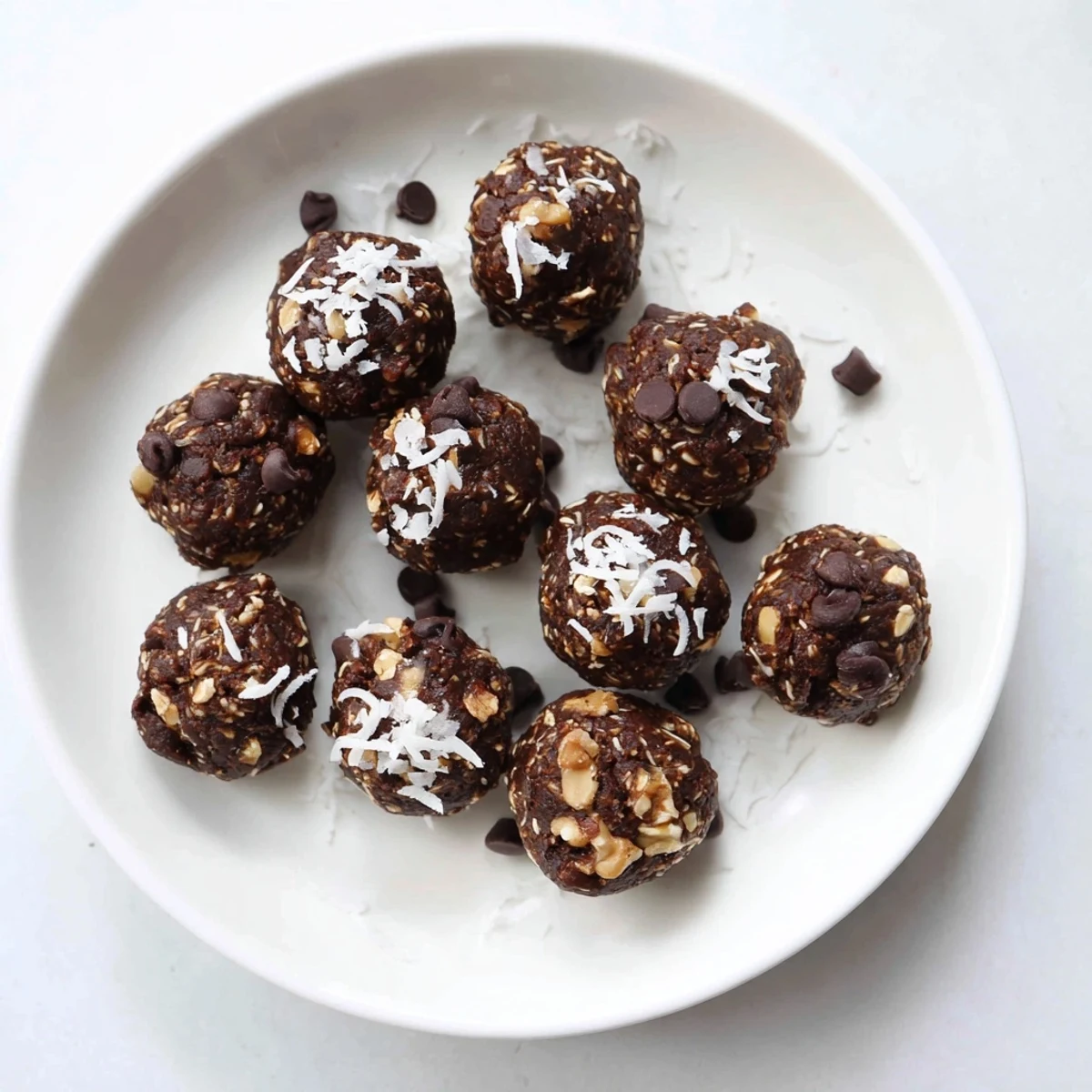 Rich, fudgy no bake brownie bites rolled in chocolate chips and coconut toppings