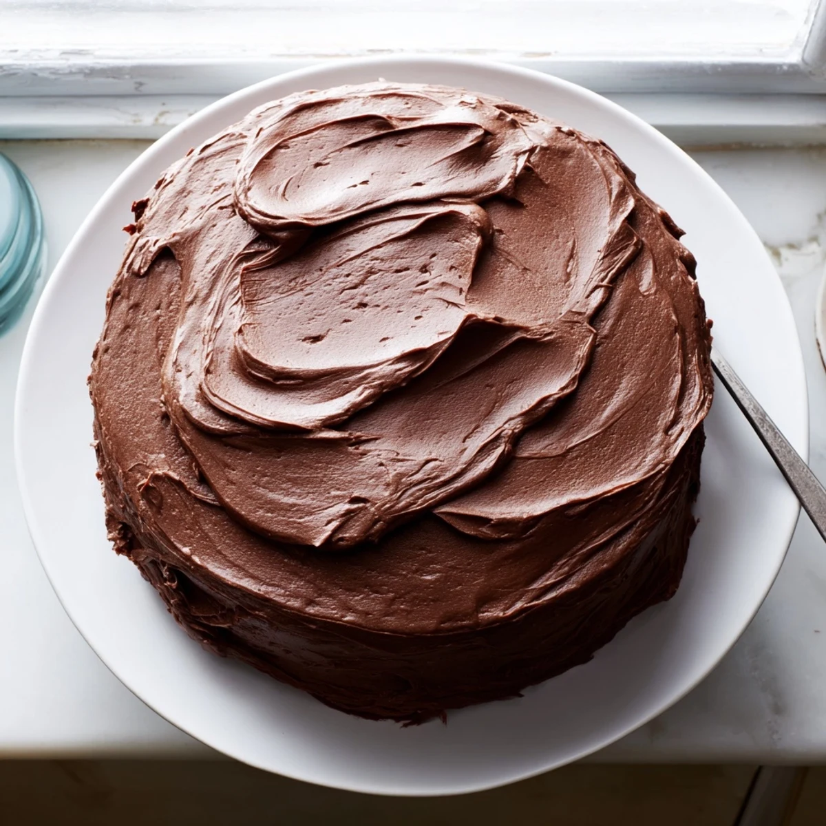 Slice of Matilda chocolate cake showing tender crumb and glossy chocolate frosting