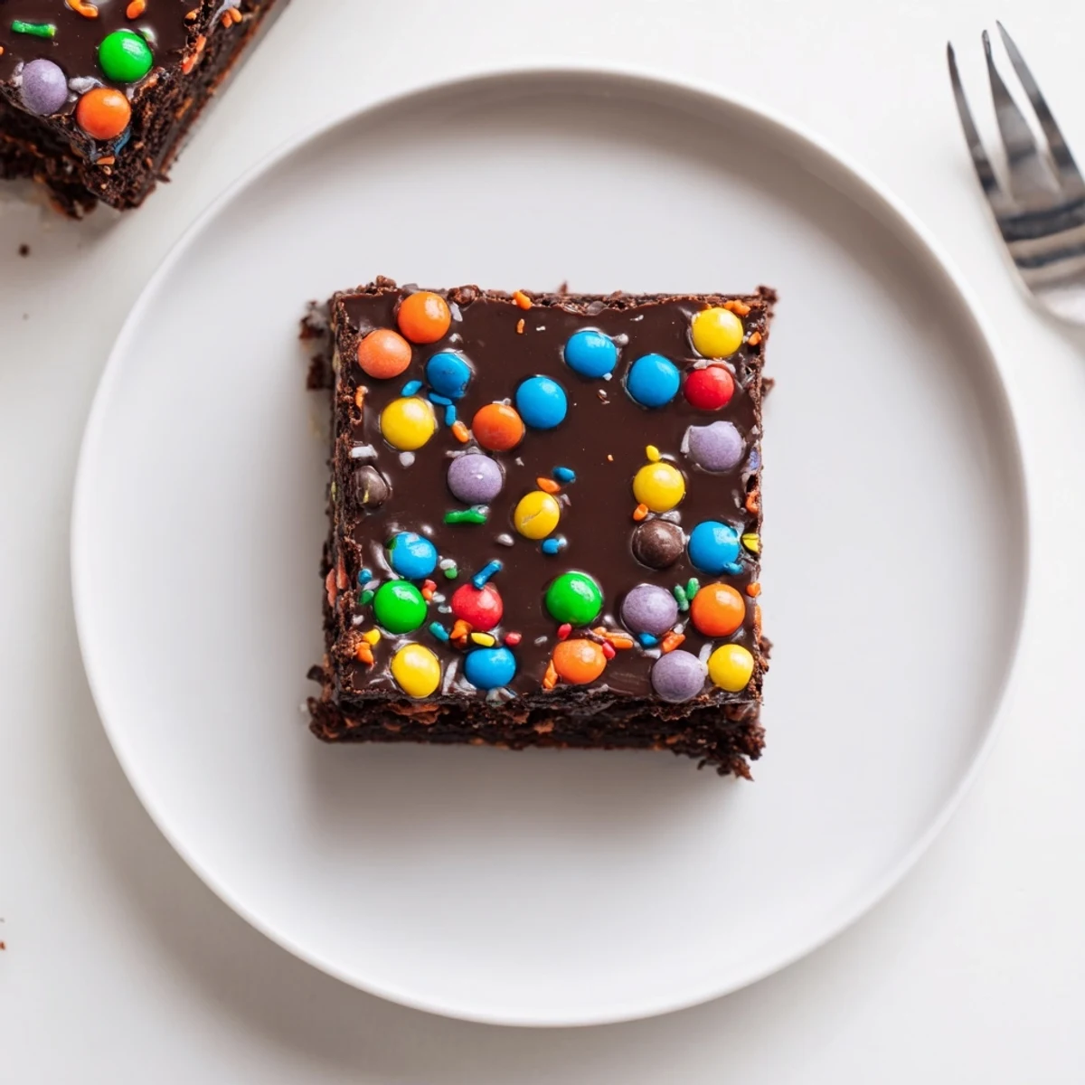 Gourmet Cosmic Brownies Bars with glossy chocolate ganache and rainbow candy crunch