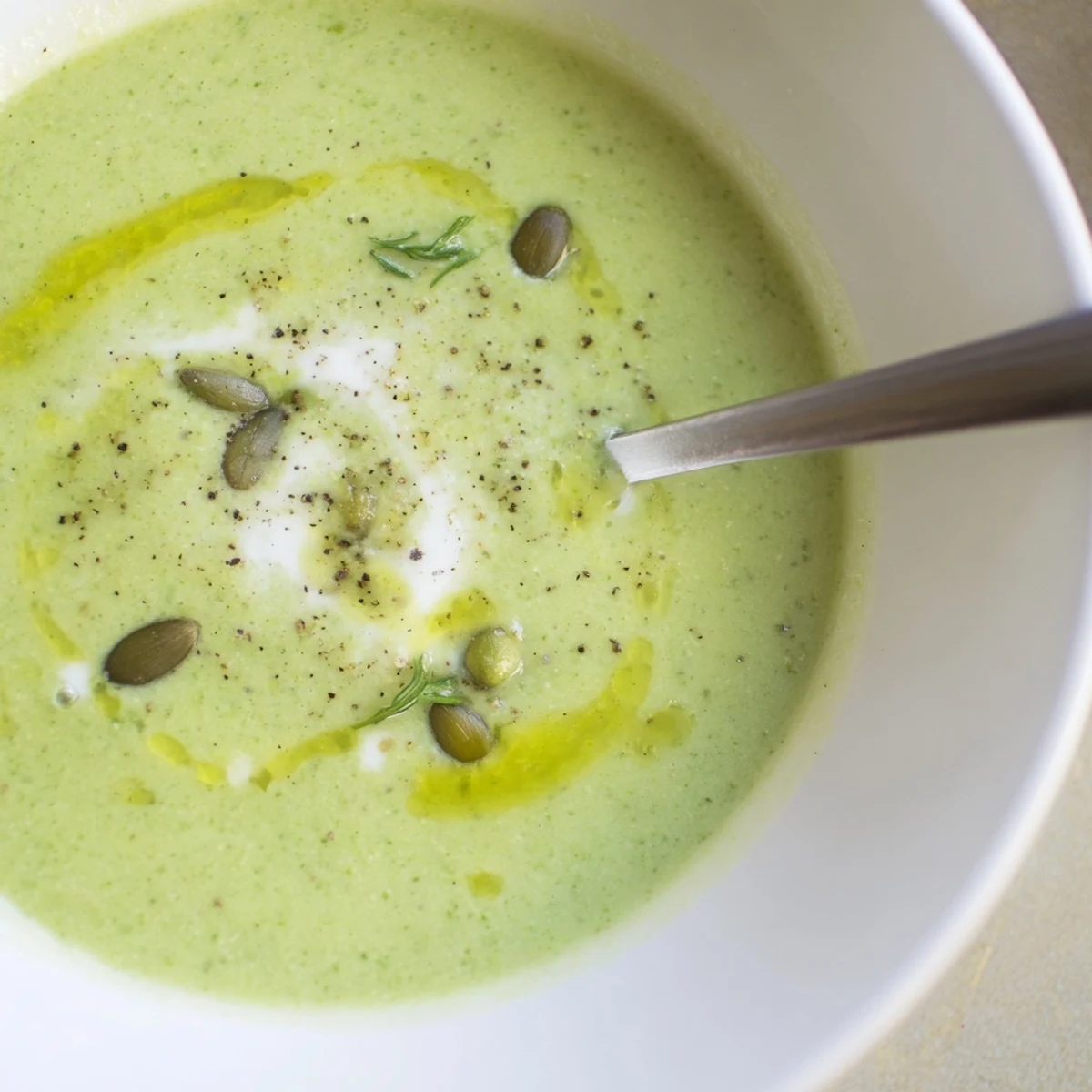 Warm Broccoli Soup with velvety cream, garlic aroma, paired with crusty bread