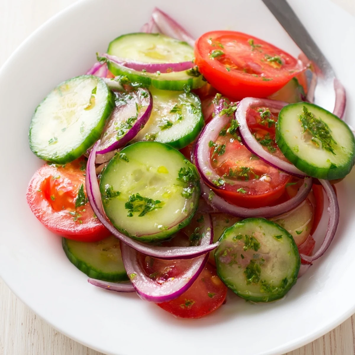 Cucumber Tomato Salad with crisp cucumbers, juicy tomatoes, dressed in tangy vinaigrette  