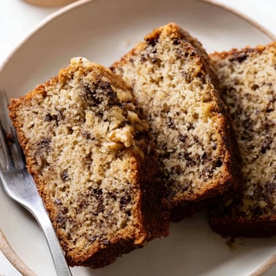 Moist homemade banana cake fresh from the oven with a crackled golden crust